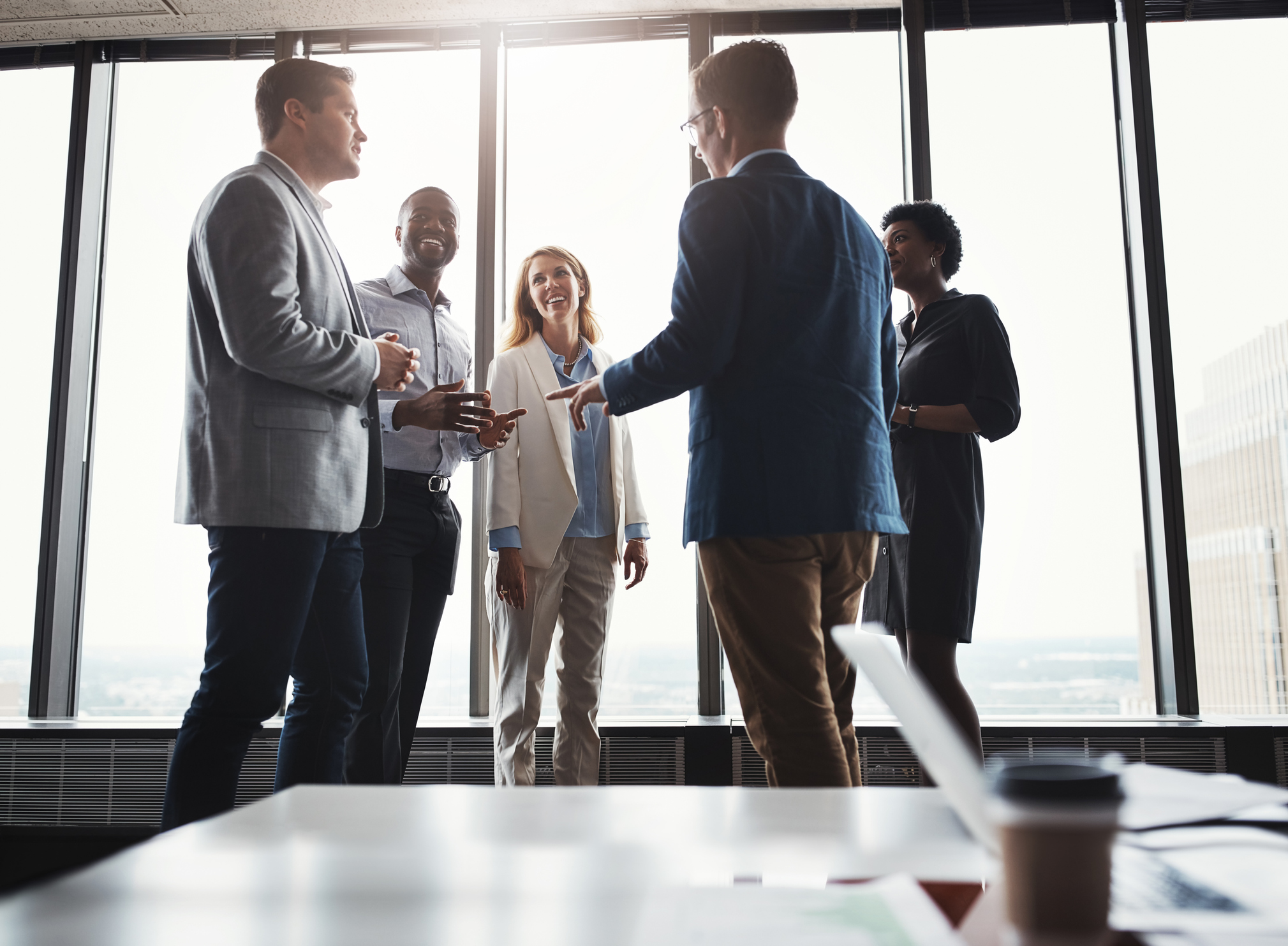 Low angle shot of a group of corporate businesspeople meeting in their boardroom